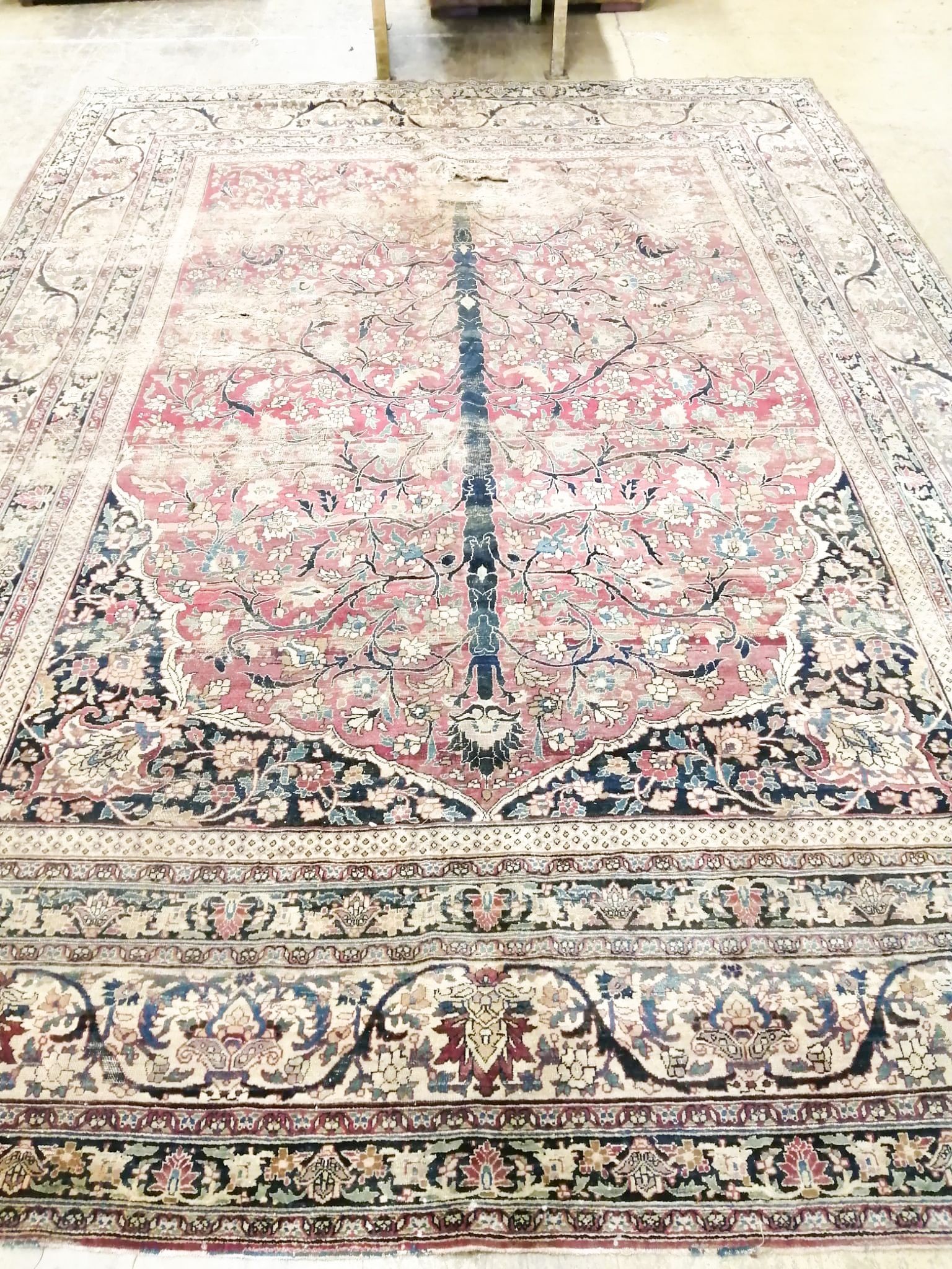 An antique Kashan blue ground carpet (worn and holed) 410 x 300cm